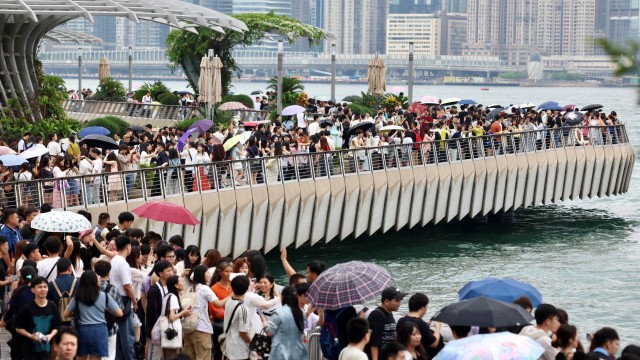 Tourists brave rain as HK kicks off Labour Day holiday